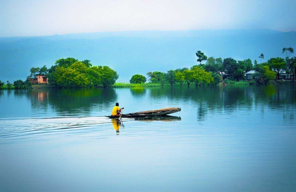 Rowing on a calm Sylhet lake